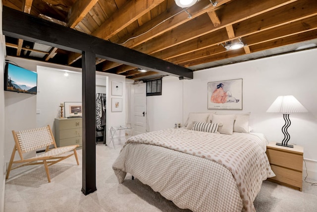 bedroom featuring light colored carpet and beamed ceiling