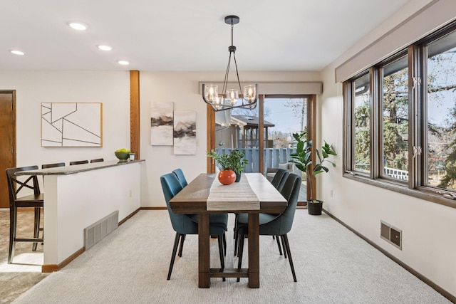 dining space featuring recessed lighting, visible vents, light colored carpet, and baseboards