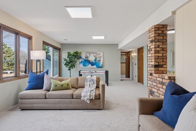 carpeted living room with a textured ceiling