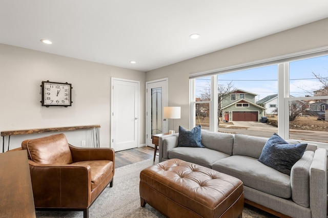 living room with recessed lighting, wood finished floors, and baseboards