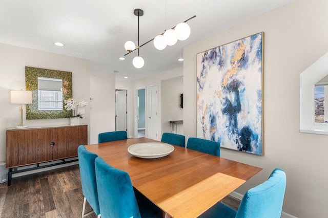 dining room featuring a notable chandelier, recessed lighting, and wood finished floors