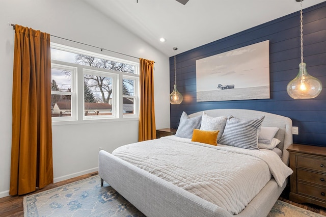 bedroom featuring recessed lighting, baseboards, lofted ceiling, and wood finished floors