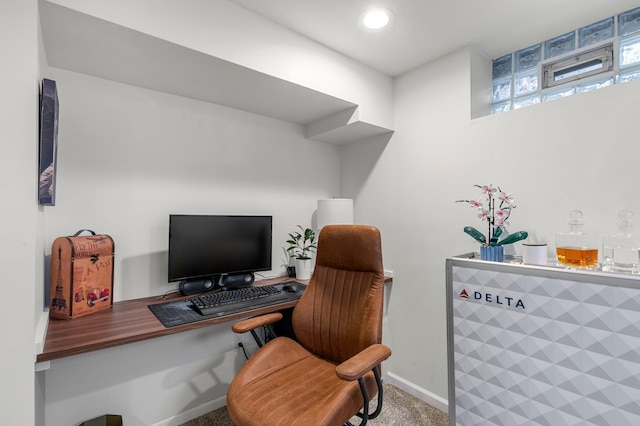 office space with baseboards and carpet floors