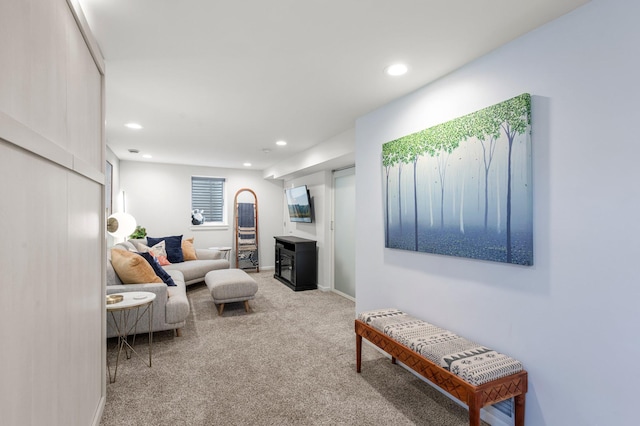 living area with recessed lighting, baseboards, and carpet floors