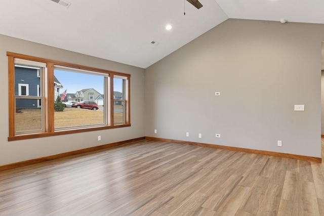 unfurnished room with light wood-type flooring, ceiling fan, baseboards, and lofted ceiling