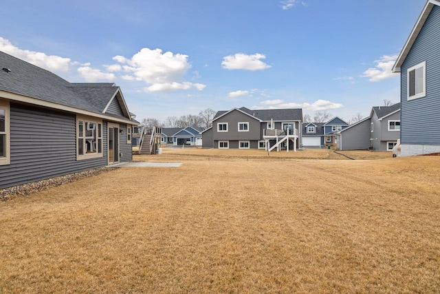 view of yard featuring a residential view