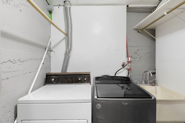 laundry area with laundry area and washer and clothes dryer