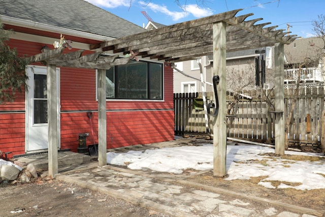 exterior space featuring fence and a pergola