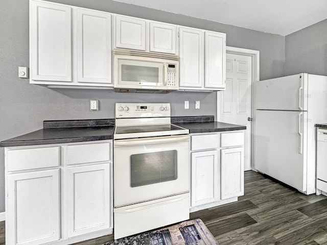 kitchen with dark wood-style floors, white appliances, dark countertops, and white cabinets