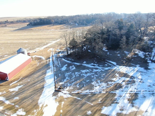 snowy aerial view featuring a rural view