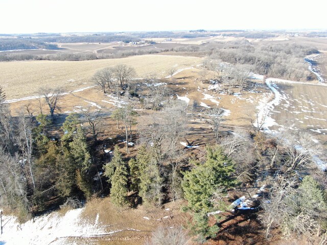 birds eye view of property with a rural view