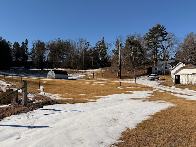 view of yard layered in snow