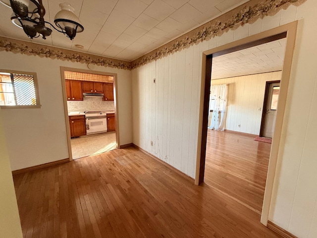 interior space with light wood-style floors and baseboards