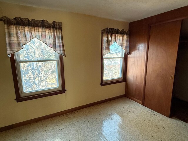 interior space featuring baseboards