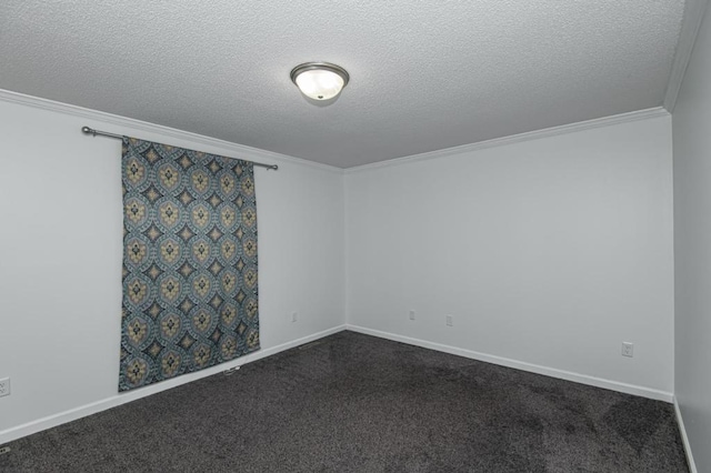 empty room with dark colored carpet, baseboards, a textured ceiling, and crown molding