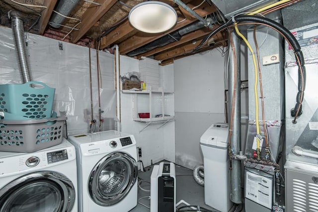 washroom with laundry area and independent washer and dryer