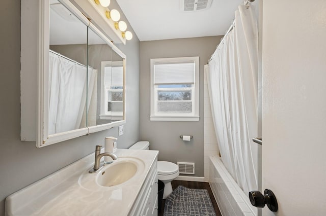 full bath featuring shower / tub combo, visible vents, vanity, and toilet