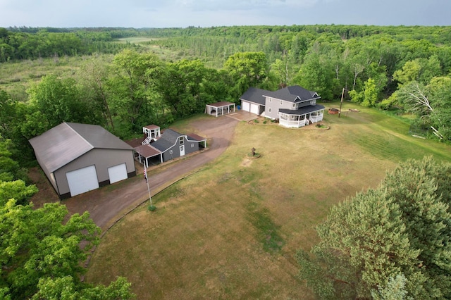 bird's eye view featuring a wooded view