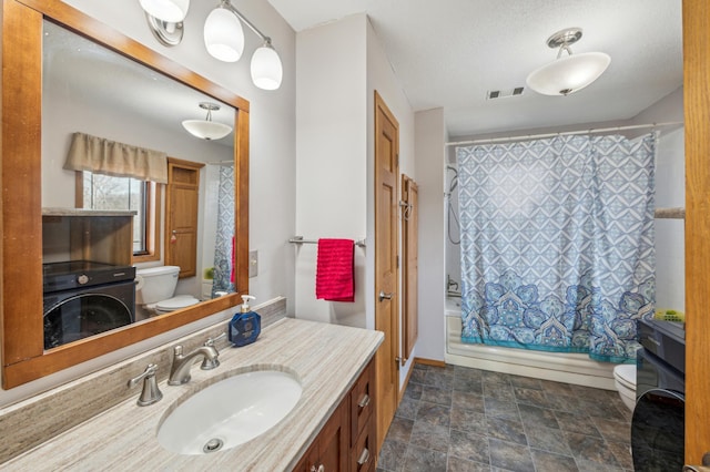 bathroom with visible vents, toilet, shower / tub combo, stone finish floor, and vanity