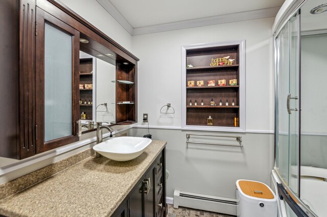 full bath with vanity, baseboard heating, and crown molding