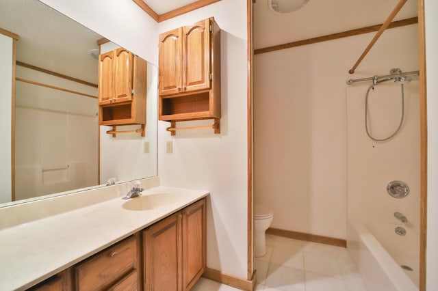 bathroom featuring crown molding, baseboards, toilet, bathing tub / shower combination, and vanity