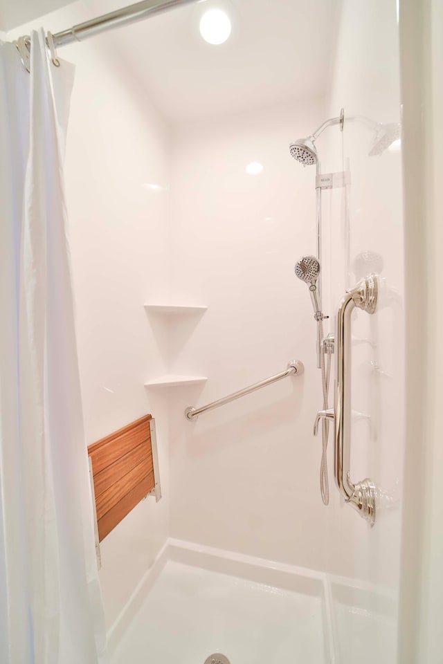 bathroom with a shower stall