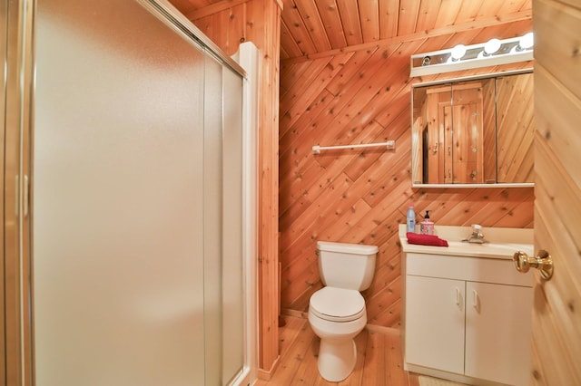 full bath with vanity, wood finished floors, a shower stall, wood ceiling, and toilet