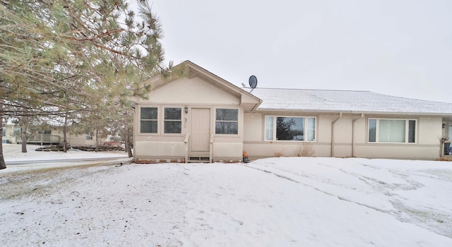 ranch-style home with stucco siding