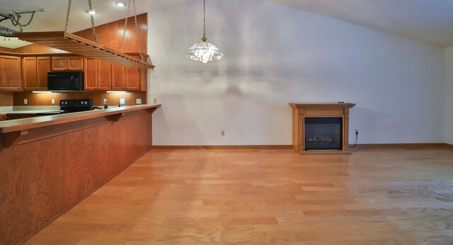 14686 Par Dr, Baxter, MN 56425 - kitchen featuring black microwave, light wood-style floors, electric range oven, high vaulted ceiling, and brown cabinetry
