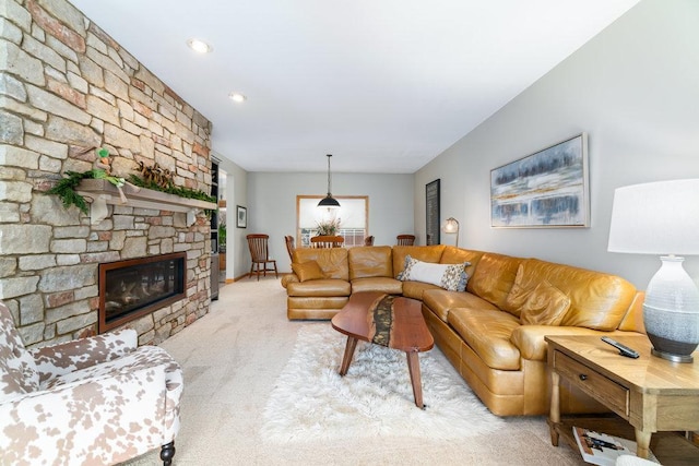 carpeted living room with a fireplace