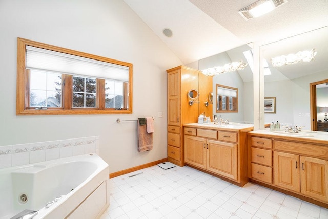 full bath with visible vents, vanity, baseboards, a whirlpool tub, and lofted ceiling
