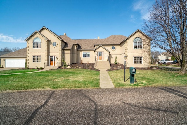 view of front of home featuring a front lawn and stucco siding