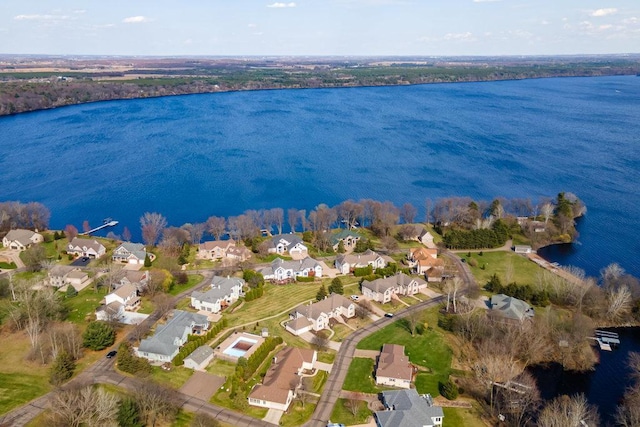 birds eye view of property with a water view and a residential view
