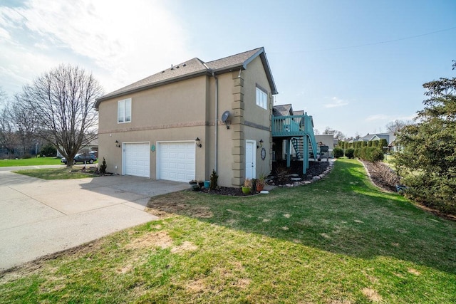 view of home's exterior featuring a lawn, stucco siding, an attached garage, driveway, and stairway