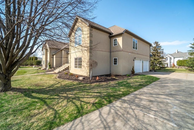 view of property exterior with concrete driveway, a garage, a yard, and stucco siding