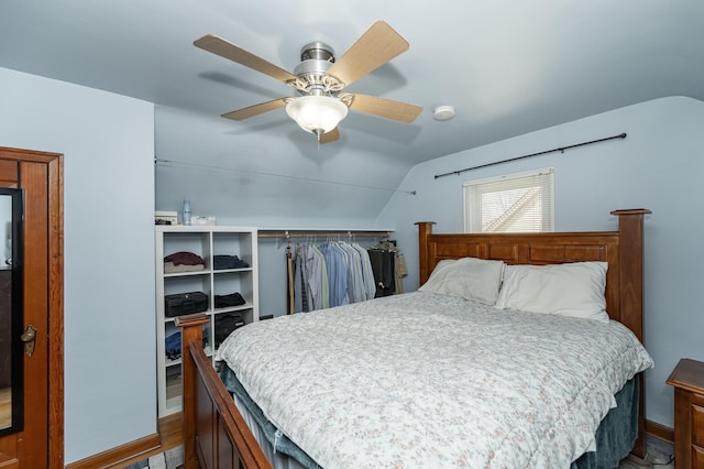 bedroom with ceiling fan and vaulted ceiling