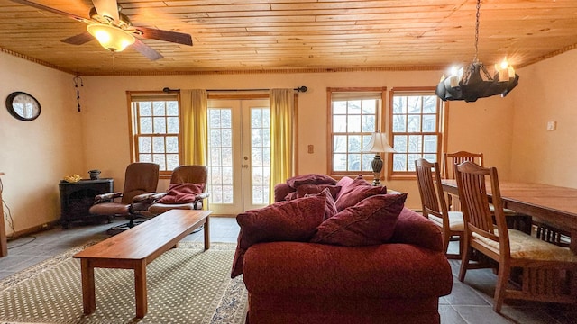 tiled living area featuring wooden ceiling and ceiling fan with notable chandelier