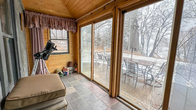 sunroom with lofted ceiling and wood ceiling