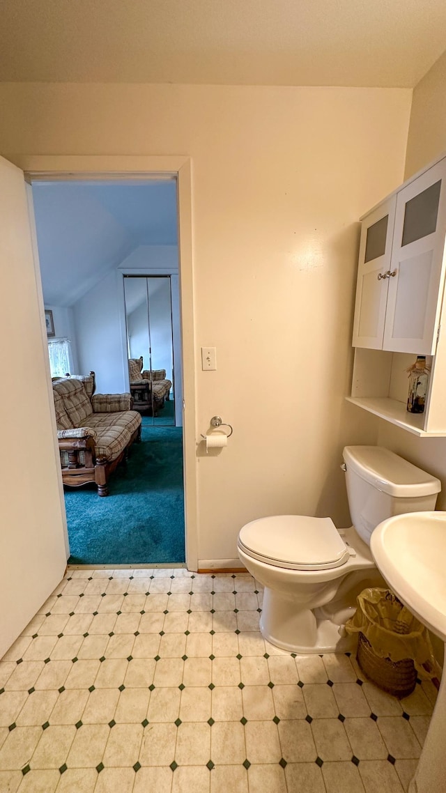 bathroom featuring tile patterned floors and toilet