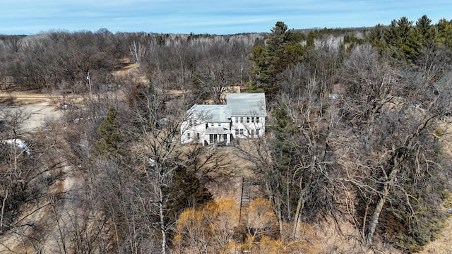 drone / aerial view featuring a forest view