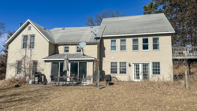 back of property with a patio area and french doors