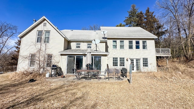 back of house with a patio area and french doors