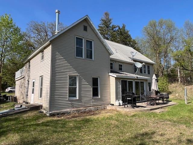 28503 Ottawa Dr, Browerville, MN 56438 - rear view of house with a yard and a patio