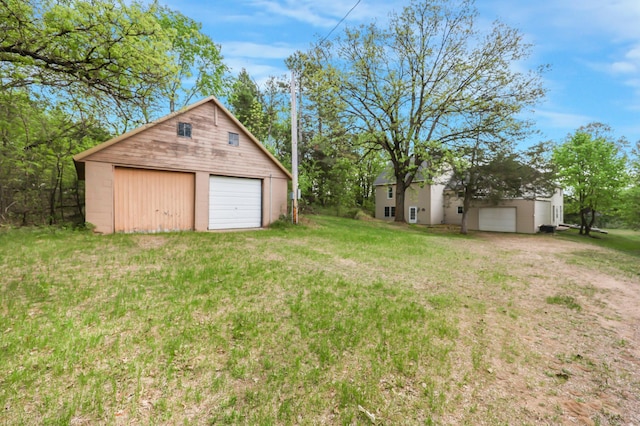 28503 Ottawa Dr, Browerville, MN 56438 - view of green lawn with a detached garage and an outdoor structure