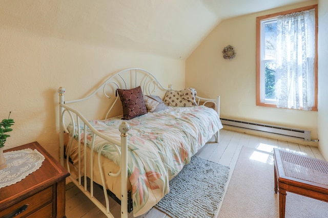 28503 Ottawa Dr, Browerville, MN 56438 - bedroom with a baseboard radiator, vaulted ceiling, and hardwood / wood-style flooring