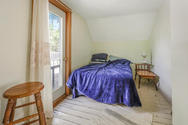 28503 Ottawa Dr, Browerville, MN 56438 - bedroom with wood-type flooring, lofted ceiling, and baseboards