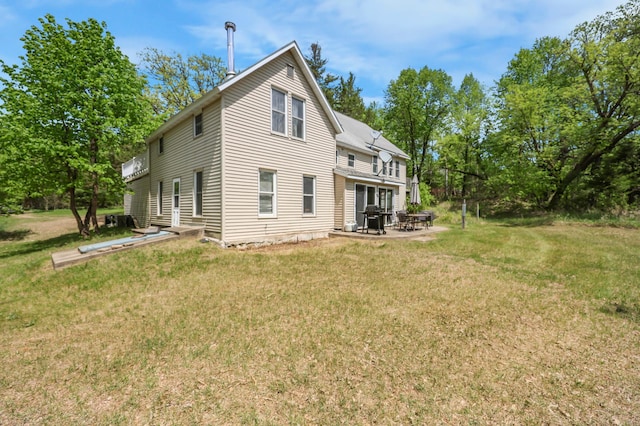 28503 Ottawa Dr, Browerville, MN 56438 - rear view of house featuring a yard and a patio