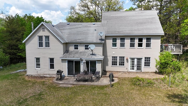 28503 Ottawa Dr, Browerville, MN 56438 - back of house featuring a lawn, french doors, roof with shingles, and a patio