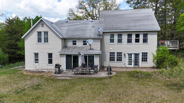 28503 Ottawa Dr, Browerville, MN 56438 - back of property featuring a shingled roof, a yard, and french doors