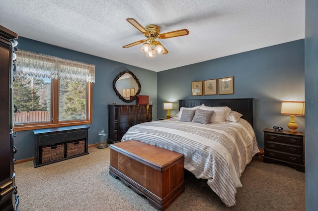 carpeted bedroom featuring a ceiling fan, baseboards, and a textured ceiling